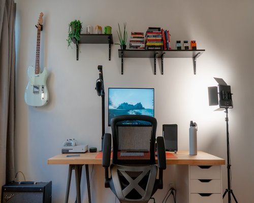 A desk setup positioned perfectly to receive indirect sunlight, avoiding screen glare